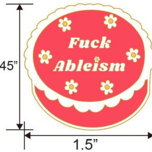 Image of cake shaped pin with white flowers and "Fuck Ableism" written in the middle in white letters